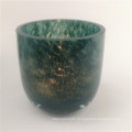 green patterned glass candle holder